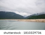 Small photo of The Meghalayan clouds, unremitting flow of waterfalls and ceaseless streams of rivers in the rainy season as well as the sandy shores that appear right after the rainy season.