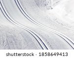 Beautiful cross country ski tracks in the snow during wintertime in the Alps (Filzmoos, Salzburg county, Austria)