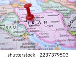 Small photo of Red Push Pin Pointing on Iran The Political World Map Close-Up View Stock Photograph