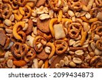 Small photo of a natural healthy trail mix snacks food display nuts peanuts pretzels corn sticks rye chips rice crackers snack background