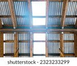 a machine shop workshop factory roof rafters ceiling light corrugated beams shed metal tin wood beams