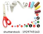 Kit design of sewing tools isolated on white background: spools of thread, needle, a pair of button scissors and a tape measure
