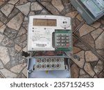 Small photo of Maintenance Prepaid electricity meter for home provided by PLN (Indonesian Goverment Electricity Company), electric meter by Itron and Schneider Electric. Sidoarjo, Indonesia - August 26, 2023