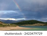 Small photo of Boats sailing on Lake Dillon in Colorado. Blue sky, blue choppy water with whitecaps on windblown water. Waves storm clouds with mountain backdrops.