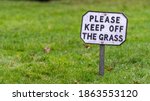 Small photo of Keep off the grass sign
