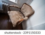 An old upholstered chair from the 19th century.