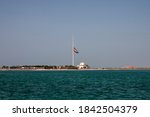 Small photo of The large United Arab Emirates flag in Abu Dhabi flying at half-mast during the 40 days mourning period after the death of Sheikh Zayed bin Sultan Al Nahyan in November 2004