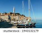 Rovinj,Istria,Croatia.View of the town situated on the coast of Adriatic Sea.Popular tourist resort and fishing port.Old town at sunrise with cobblestone streets, colorful houses and fishing boats