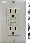 Small photo of Indoor electrical outlet for bathroom. Receptacle outlet self test. Tamper resistant security mechanism. Prevent shock or electrocution. Ground fault circuit interrupter.