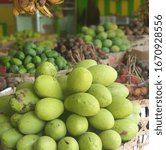 Small photo of Mangifera Kemanga or buah Kemang or buah Wani at the fruits market in Bali, is a rare Indonesian original fruit, has a white flesh and distinctive odor. The taste is sour and sweet.