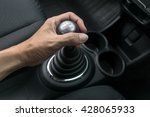 Man hand holding manual transmission 