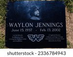 Small photo of City of Mesa Cemetery, Mesa, Arizona, USA - May 10 2023: Close up of Waylon Jennings grave maker at City of Mesa Cemetery in Mesa, Arizona