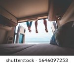 couple in a camper van on the beach