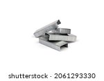Close up stack of metal staples for stapler on a white background