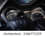 close up of speedometer, tachometer. motorcycle, motorbike, bigbike. dashboard detail with indication lampe. fuel level gauge. motor speed control 1000 rpm-min. in garage view soft focus and lens flar