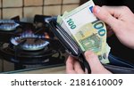 Small photo of Bielsko, Poland - 07.23.2022: Euro banknotes on the background of a gas stove. Concept showing the energy crisis in Europe. Increase in prices and difficult gas availability