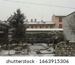 Small photo of View with snowy garden. The snow is still unceasing