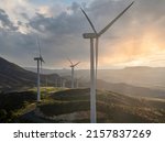 Beautiful wind turbine in the countryside in the time of sunset background. Wind Turbines Windmill Power Farm. Carratraca on the outskirts of Malaga, Spain.