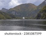 Small photo of flam, norway - 09 28 2023 scenic view of a cruise liner in a fjord in flam