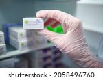 Small photo of Brno, Czech Republic: September 3 2021: A hand of a medic taking out a vaccine called Boostrix Polio, manufactured by GSK Canada. Booster vaccinationof individuals from the age of four years onwards.