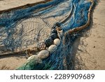 Small photo of Fishing nets dry on shore.Pile commercial fish nets and gill nets.