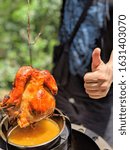 Small photo of Whole roasted chicken with a thumb,good taste!