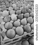 Small photo of Piles of eggs that are sold in the market with unfavorable conditions and are rather dirty.
