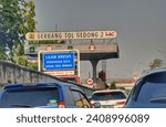 Small photo of East Jakarta, Indonesia on July 6 2023. Gedong Toll Gate 2 signboard. One of the toll gates on the Jakarta Outer Ring Road Toll Road.