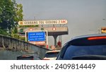 Small photo of East Jakarta, Indonesia on July 6 2023. Gedong Toll Gate 2 signboard. One of the toll gates on the Jakarta Outer Ring Road Toll Road.