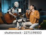 A cute young girl enjoys her A.I.-equipped Domestic Robot playing Karaoke. He plays the guitar, and she sings.