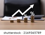 Small photo of Interest rate and dividend concept. Businessman is calculating income and return on investment as a percentage. Show returns from mutual funds and stocks. long term investment for retirement