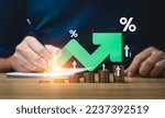 Small photo of Interest rate and dividend concept, Businessman is calculating income and return on investment in percentage. income, return, retirement, compensation fund, investment, dividend tax, stock market