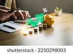 Small photo of higher interest rates and dividends, pile of coins and percentage of company profits. saving money for Invest in growth and pay out dividends, cash reserves.compensation fund for retirement