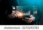 Small photo of Businessman analyzing business enterprise data management, Business analytics with charts, metrics and KPIs to performance organization. Corporate strategy for finance, operations, sales, marketing