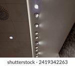 the ceiling of the corridor in the plasterboard soffit is equipped with light halogens illuminating the ramp on the stage or in the shop. the goods look better if there are strong lamps in the ceiling