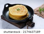 Small photo of roti canai or paratha (Parotta) flat bread, or also known as roti maryam in indonesia.