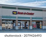 Small photo of Houston, Texas USA 11-12-2021: RAC Rent-A-Center business exterior in Houston, TX. Rent-to-own chain store company incorporated in 1986.