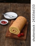 Small photo of Bolu gulung or Bolu rolls are baked cakes using a shallow pan, filled with jam or butter cream then rolled. Bolu rolls are often known as jam roll or jelly roll
