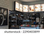 Small photo of Chick-fil-a fast food restaurant electronic menu. Chick fil a restaurant interior. Everett, WA, USA - April 2023