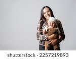 Small photo of Latin American mom with her baby. Mother's Love. Baby smiling. Single mother and her son. Mother and baby very happy. Young mother holding her baby.