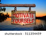 motivate yourself motivational phrase sign on old wood with blurred background