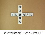 Small photo of letters of the alphabet are crossed with nouns and plurals. English education concept