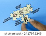 Small photo of wooden puzzle with the icon of The 4 Disciplines of Execution i.e. Focus on the Wildly Important, Act on Lead Measures, Keep a Compelling Scoreboard, Create a Cadence of Accountability