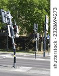 Small photo of Accident, Knocked down traffic light pole, Barrier tape, Kink, Broken, Bent metal pole, Traffic signs, Stuttgart, Germany