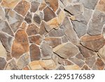 It is colorful big stones in a wall. The background is unfocused with art noise. This is a texture for designer. 