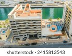 Small photo of Dubai, UAE - May 29, 2019: It is view of Dubai Marina and rooftop of a building apartment on promenade. It is Falcon hotel. It is Perl Marina hotel.