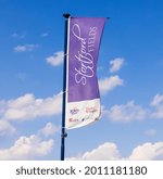 Small photo of Bishop's Stortford, Hertfordshire. UK. July 19th 2021. Stortford Fields advertising flag banner at the Stortford Fields Housing development built by Bovis, Persimmon, Kier and Taylor Wimpey.