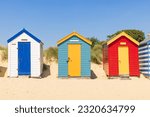 Colourful wooden beach huts on...