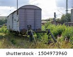 Small photo of old freight railway car on the sidetrack