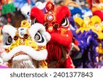 Chinese lion dance show on street in the Chinese New Year festival.Chinese lion costume used during Chinese New Year celebration in China town.Holidays and celebrations concept. Selective focus.